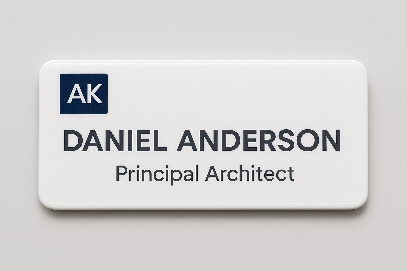 Close-up custom name badge with a full-color logo printed on glossy white plastic