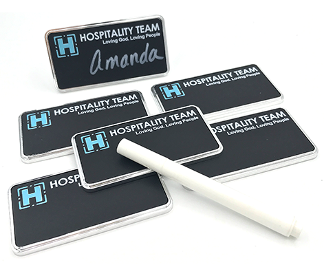 Reusable chalkboard name badge with chalk writing surface for temporary names and events